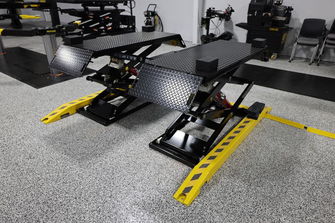 Pair of DX77 scissor lifts with open, cross-member-free underside