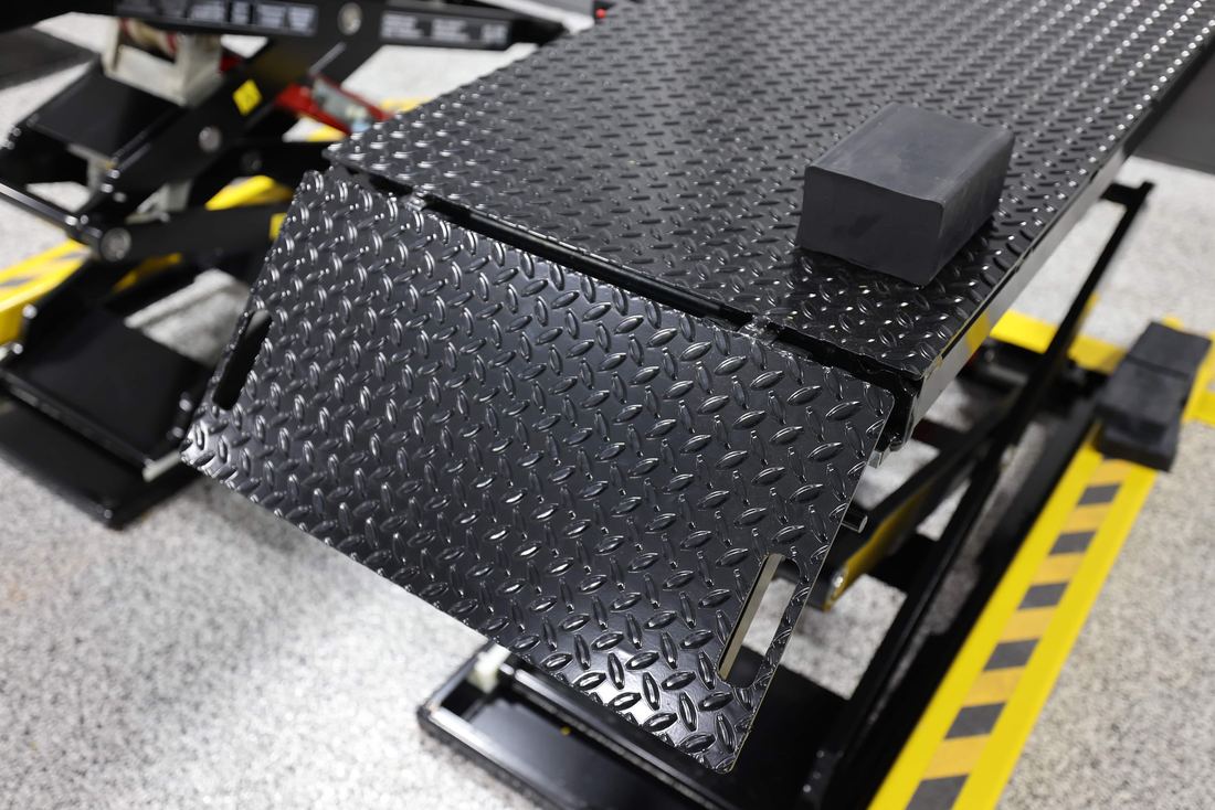 DX77 reinforced diamond-plate flip-up access ramp
